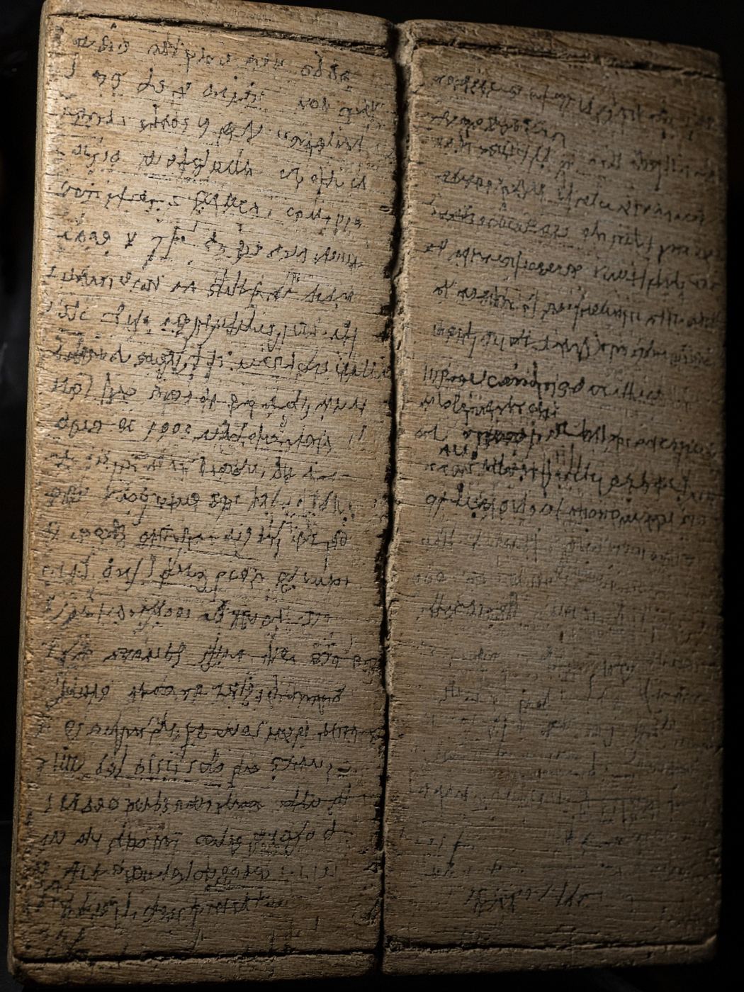 A thin Roman wooden writing tablet with faded ink handwriting
